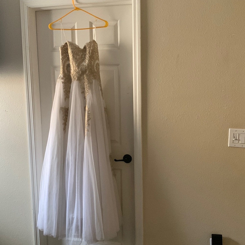 Size 3 white prom/formal dress. I have only worn it once (no stains or tears)